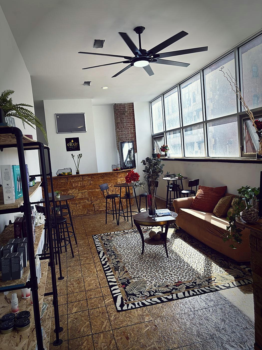The MedSpa 813 lounge with tall windows overlooking Jewelers Row